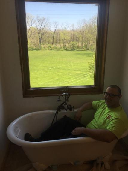 kevin-szabo-jr-having-fun-while-installing-free-standing-tub-in-bathroom-remodel